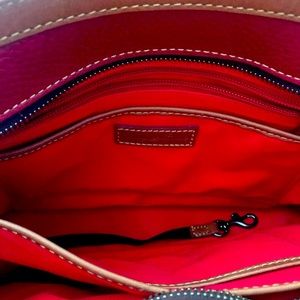 Dooney and Bourke beautiful, genuine leather burgundy colored purse. Awesome!